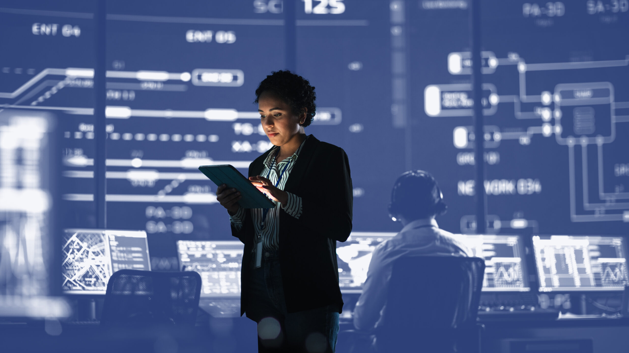 Young Multiethnic Female Government Employee Uses Tablet Compute