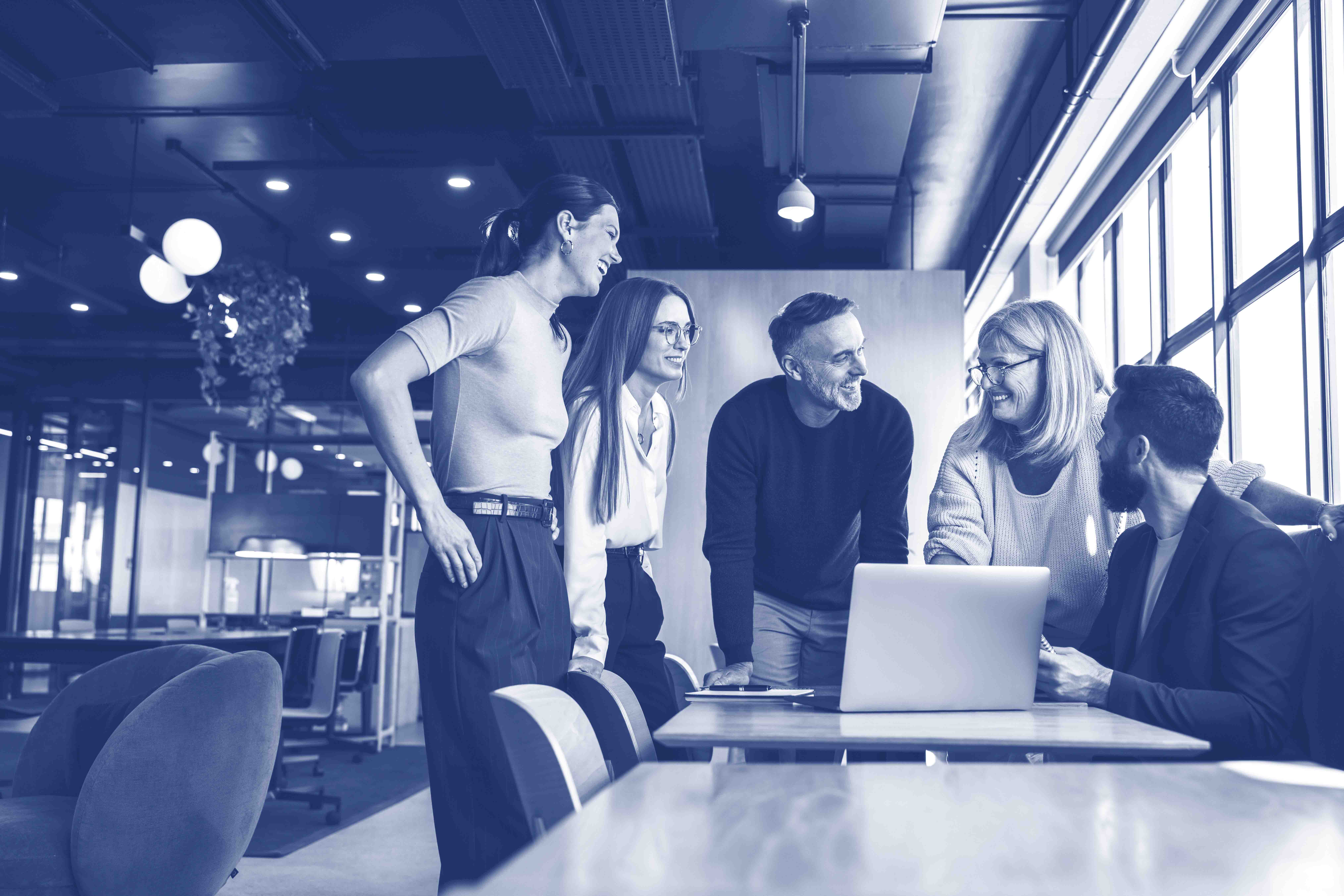 Smiling businesspeople having a discussion in an office