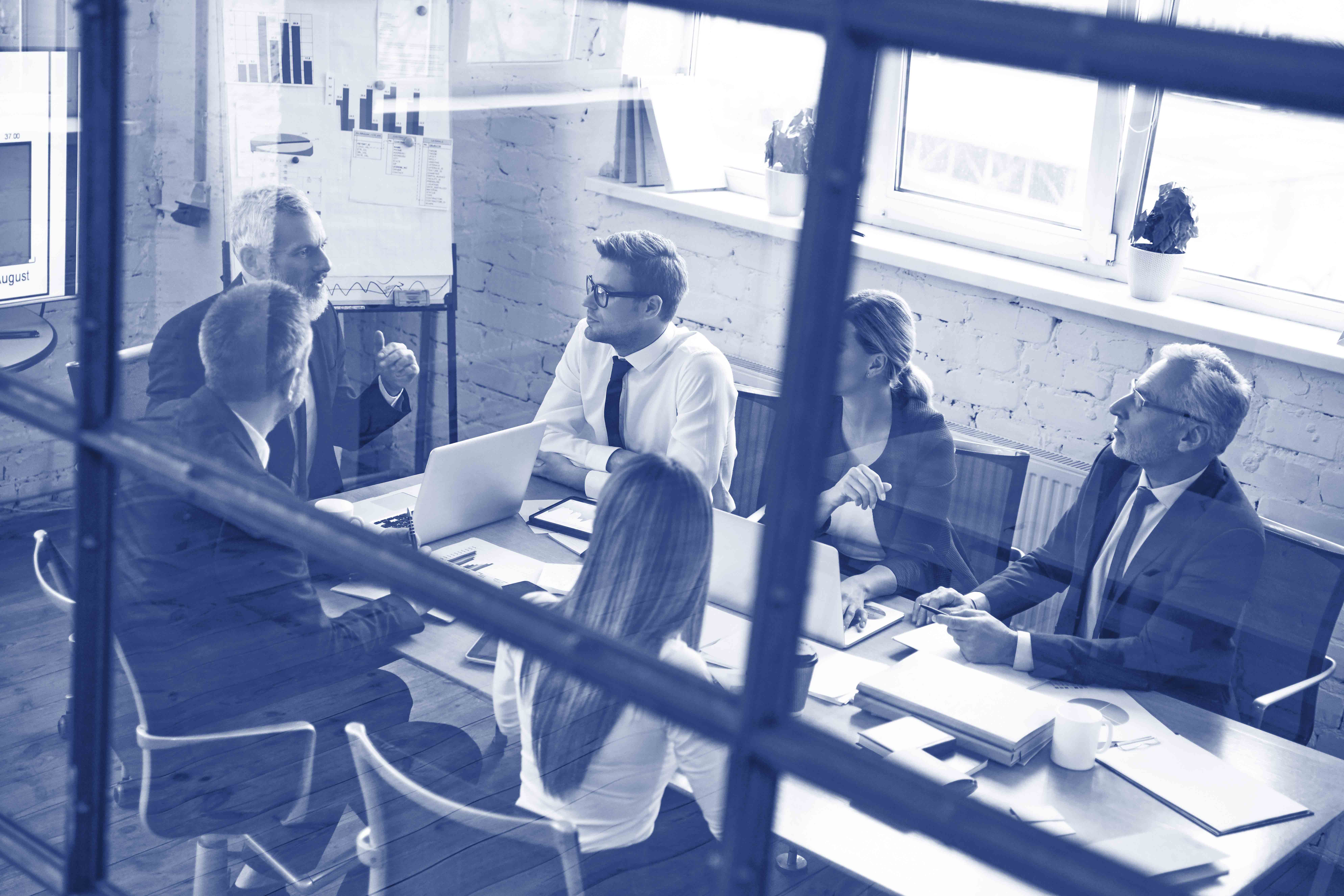 Top view of successful business team analyzing strategy while wo