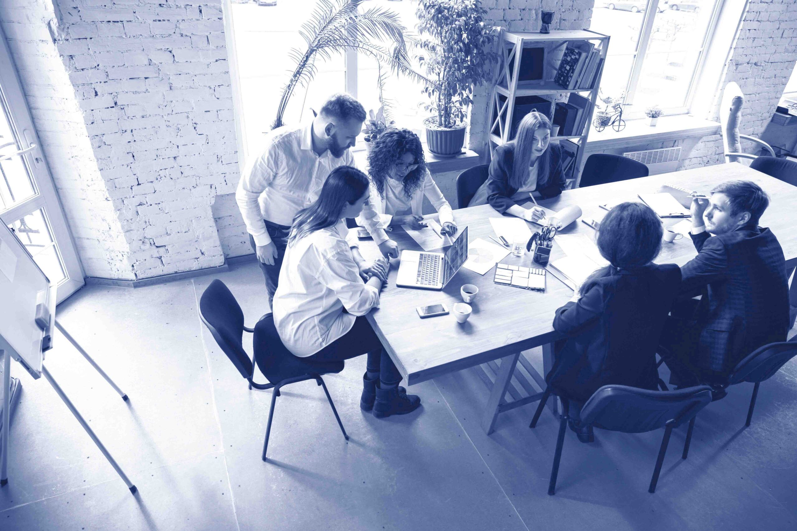 Group of young business professionals having a meeting, creative office
