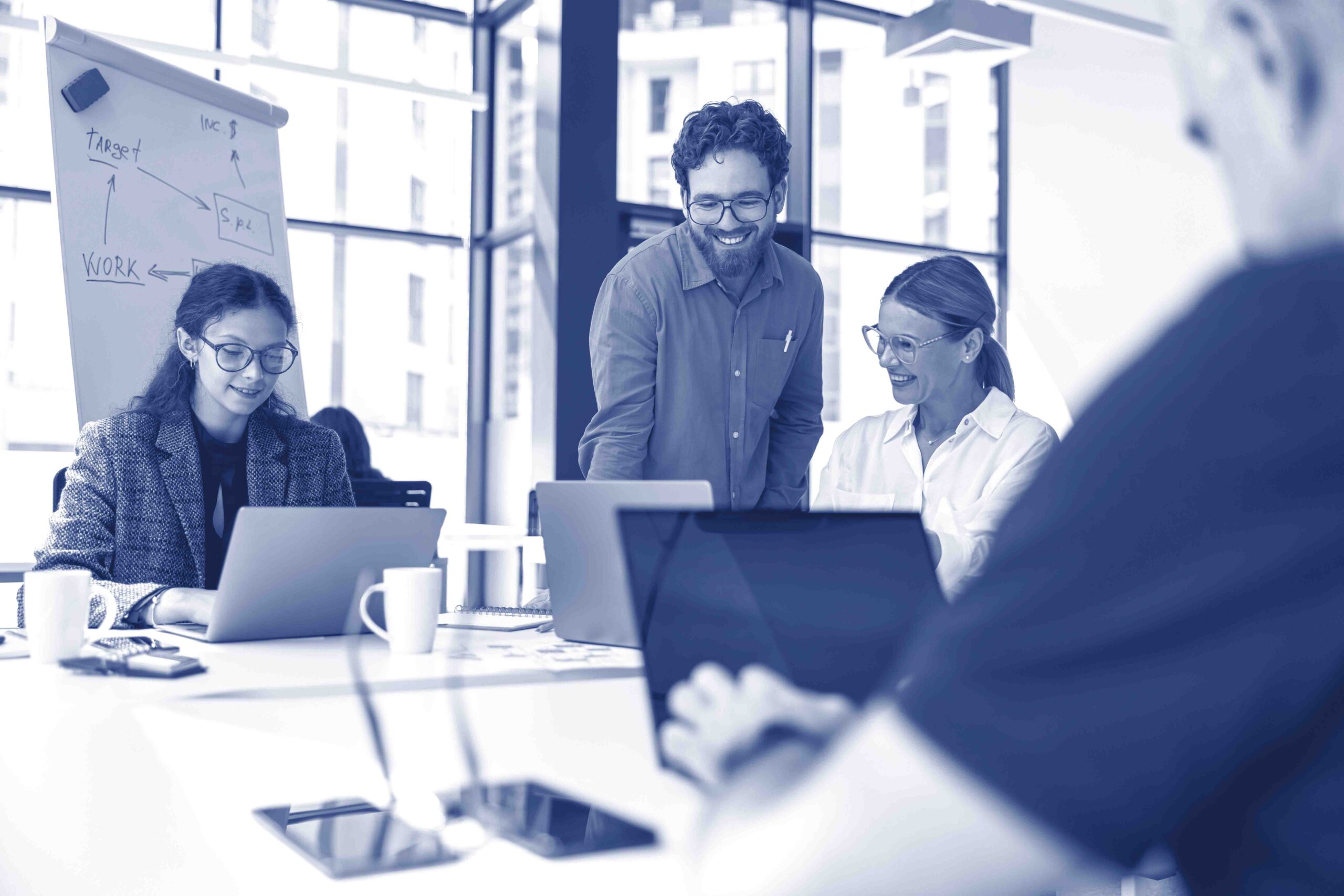 Group of diverse people discussing new project in office meeting room. Business teamwork situation